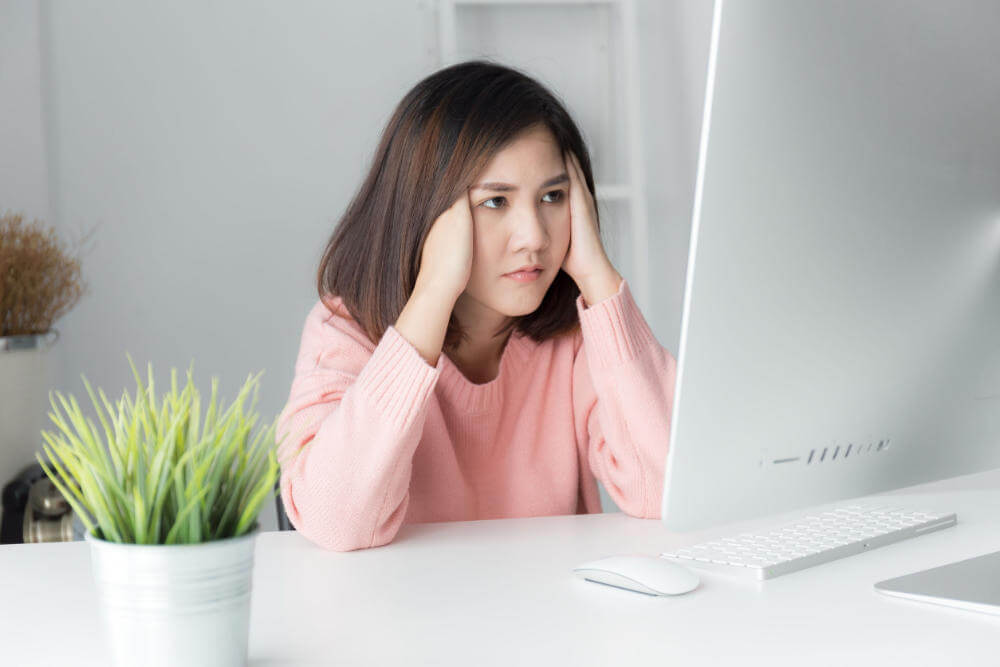 Website Audit & Upgrade Service 1 woman stressed out on computer sm - Website Audit & Upgrade Service